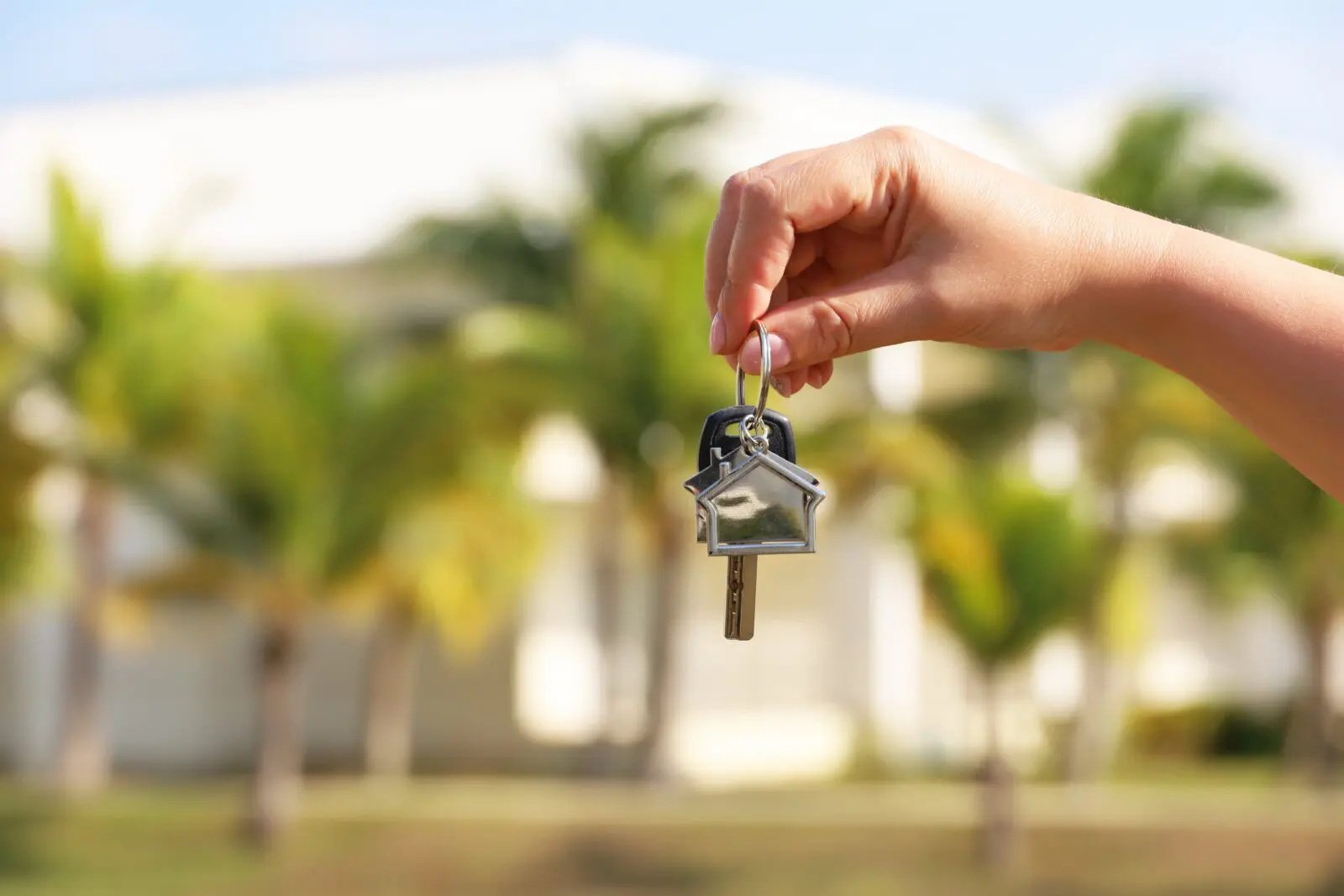 hand holding new house keys